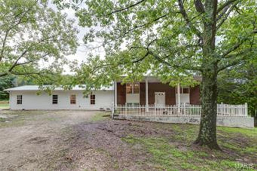 Beautiful & peaceful, surrounded by 10+ acres, this home is perfect for your growing family & your mini farm.  Features include over 2600 sq ft of total living space, 4 beds, 3 full baths, large master suite with luxury bath and his & hers closets, updated kitchen with lots of custom cabinets, walk in pantry, French door to the deck, 6 panel doors, updated bathroom, wood burning fireplace, instant water heater, Nest thermostat & iHome components.  Lower level has walkout, laundry room and is totally finished – add a closet to make 5 bedrooms. The 2-car garage is over sized with space for a workshop. The property is simply beautiful, mostly level to gentle slope, primarily wooded, includes a 3-stall barn and is partially fenced.  Relax on the deck or enjoy the covered front porch.  Septic is newer.  Wildlife is abundant, no restrictions & county maintained roads.   USDA loan eligible location - easy access to Hwy 30.  Showings begin Saturday 7/20 - Open House Sunday 7/21