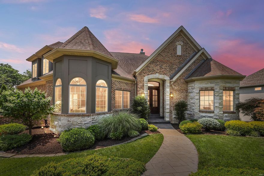 Stunning, custom built 1.5-sty w/spectacular views from all vantage points! Over 6100 sqft of total living area w/5 Bds, 4.5 Bths & incredible LL!  An entertainer's dream w/gourmet Kitchen, custom cabinets, breakfast bar, butler pantry & Breakfast Rm. Vaulted Hearth Rm w/stone FP. Master Ste w/elegant tray ceiling, dual walk-ins w/organizers, gorgeous views from large bay & luxury Bth w/dual vanities, shower & corner Jacuzzi tub. Spectacular wrought iron spindled staircase leads to the Upper Level w/3 Bds, 1 en-suite, other 2 share Jack/Jill Bth. Professionally finished W/O LL w/10' ceilings & generous Guest Bed, full Bth, spacious Family Rm w/gas FP, Rec Rm & rough-in plumbing. Highlights: Main Flr Laundry w/sink, O/S 3 car garage w/epoxy floors & built-ins, refinished wood floors, fresh paint (2021), new carpet in Master (2021), new light fixtures (2021), 2 decks, zoned HVAC w/newer furnace (2020) & newer A/C (2017) & professional landscaping w/sprinklers.