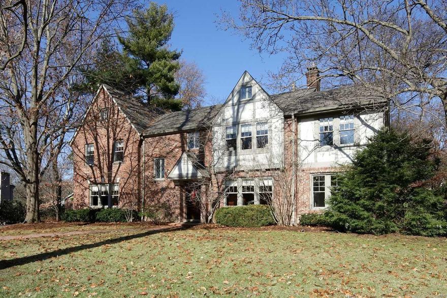 Great new price. Gracious style & timeless charm are hallmarks of this enchanting English tudor, nestled on a private acre in one of Ladue's most coveted lanes. Step into the  beautiful entry foyer introducing exquisite architectural details that include leaded glass windows and gorgeous millwork.  Graciously  appointed living & dining rooms are both elegant & generous in size allowing for formal entertaining. French doors open to a cozy sunroom with a private side patio. Handsome gourmet kitchen features custom cabinetry, stainless steel appliances, eating area, large center island and bar area opening to a charming hearth room with wood burning fireplace. Upstairs is a private master suite with adjacent sitting room. All the bedrooms are generously sized with direct access to a bathroom and abundant closet space. The third floor suite for guests, teens or live in help. Picturesque yard with lush gardens, inground pool and blue slate patio is your private oasis. 3 car garage. Additional Rooms: Sun Room