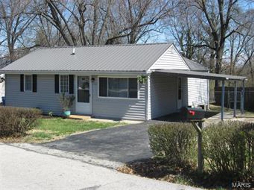 *Multiple Offers* Updated: Metal Roof, Bathrooms, 6 Panel Doors, Interior Paint, Oak Cabinets with Adjustable Shelves, Counter Top, Sink, Microwave, Laminate Flooring in LR and Hall, Carpets in Bedrooms, Ceramic Tile in Kitchen, Breakfast Room, Bathrooms. 15x10 Deck with Steps down to the Big Backyard with Storage Shed on Concrete Pad.  Open Floor Plan, Nice Backyard!