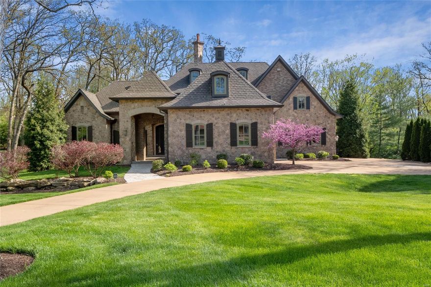 Stunning European Custom-built Home on 1 Acre in Frontenac with over 8,000+ sq.ft. This Exquisite Home features soaring Ceilings, millwork and High-end finishes! Beautiful 2 stry Limestone entry w circular staircase to 2nd flr and LL sets the tone of this Masterpiece. Main flr features Vaulted GR, stone FP, wet bar with 3 sets of arched French to outdr living space W Wood burning FP overlking backyard. Chefs Kitchen w custom wood top center Island, stone counters and backsplash,full sized Subzeros, Wolf 48"Gas range,2 dishwashers,2 sinks and a Butlers pantry adjoins Bfast area and Hearth Rm w stone FP. Coffered Master bedrm suite w spa like marble Bath & His/Her large walk-in closets and In-Law quarters on main Flr. 3 En suite Bedrms on 2nd level w large sitting rm. Walkout LL with 5 French drs, Media rm, Exercise Rm, Stone wine cellar, Wet Bar & 6th bedrm suite walk out to covered patio & backyard.4-car side garage, circle drive, sprinkler system, invisible dog fence and so much more! Additional Rooms: Wine Cellar