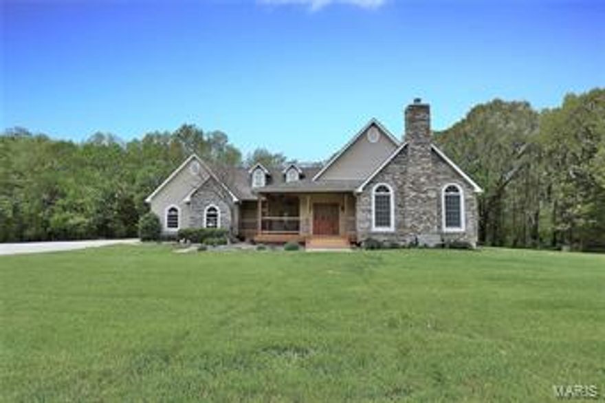 *MOTIVATED SELLER*  This beautiful custom built 3-bedroom, 2.5-bath ranch offers many updates which includes a wonderful wrap-around, covered porch perfect for evening dinners and back patio for morning coffee. Inside offers formal dining room and breakfast room. All kitchen appliances, including refrigerator in the spacious 3-car garage, are included. Coffered and vaulted ceilings with skylights. Two closets in master bedroom with access to patio. Master bath has plenty of counter space, two separate sinks, large corner tub, linen closet, and shower. Main floor laundry, walk-out basement with rough-in, plus efficient geo-thermal heating and cooling with humidifier.  All of this nestled on approximately 5 acres with level yard backing to woods for plenty of privacy. The car enthusiast will love the 40x40 heated outbuilding that has a hydraulic vehicle lift and compressor that is plumbed throughout with fittings to connect your tools!