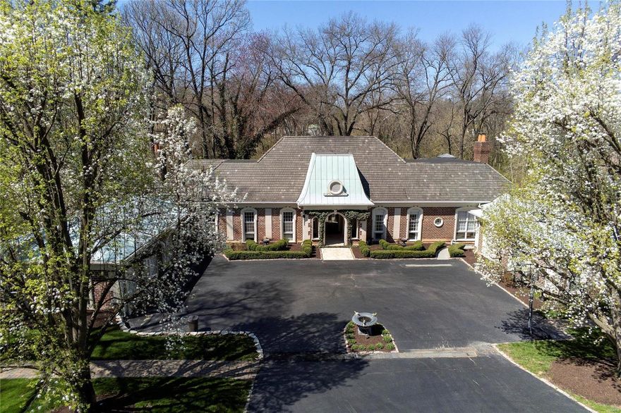 Showings start Tuesday, April 13th
7,000+  square feet of elegant living space on 3.0 lush acres.  5 Bedrooms, 5 Bath. French inspired architecture. Extremely private. Resort-style 52x18 Pebble Tec pool, patios, terraces, with manicured grounds. 1.5 Story Great Room and Library. Separate main floor Master Wing w fireplace.  En suite Master Bath includes two separate closets & dressing areas. Private guest wing/apartment with own entrance, kitchenette & full bath, plus a laundry OR possible self-contained pool house area. Drive up to residence through an extended single-lane road to motor court and circular drive. Custom finishes and moldings throughout. 3-car garage. Adjacent to Bogey & Log Cabin Clubs.