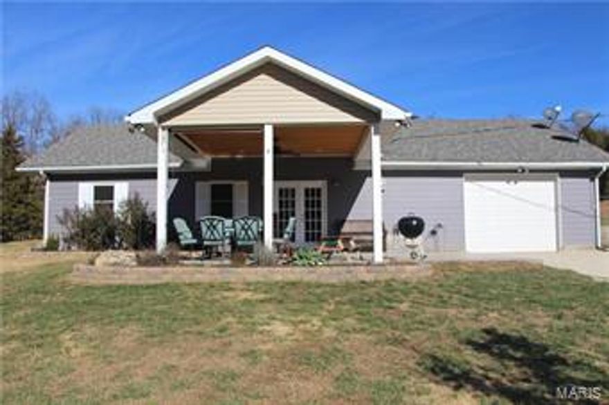 1200 Square ft 2 bedroom 2 bath home on secluded flat 5.21 +/- acres with a great mixture of field and woods. Home is last house on a dead end road. It's in Grandview school district. Backs up to 150+ acres of woods. Nice for horses, hunting. Lots of wildlife and privacy. Includes area dug for pond. 1 car oversized garage. Large covered stamped concrete pad , great for entertaining. Inside of home is completely remodeled, everything less than 8 years old. Newer carpet, newer roof, newer water softer, newer flooring throughout, newer windows, newer water heater, newer ceiling fans, large soaking/jet Whirlpool tub. This is a cute home that is perfect for the family that loves the outdoors.