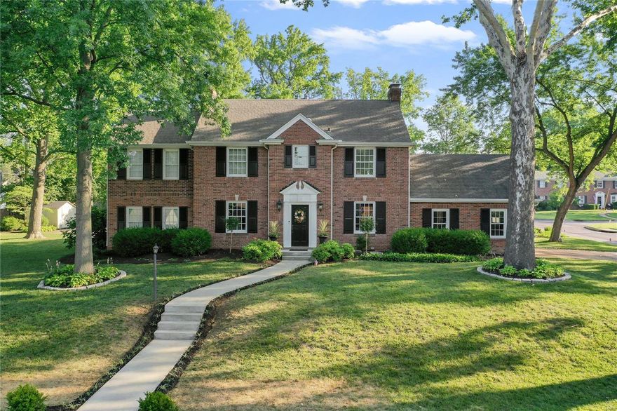 Perfectly maintained & graciously loved for many years! This impeccable home is awaiting a new family to enjoy the almost 1/2 acre lot on this sought after street. Enjoy the wrap around veranda while entertaining or just on a lovely seasonal night. The double lot offers a nice side yard w/ a sport-court, inviting patios & surrounded w/extensive landscaping. The charming center hall opens to the dining room & living room, built-ins & French doors. The main floor family room is bright & full of cheer w/ built-ins & access to outside. The knockout custom kitchen is a chef's dream w/quartz counters and backsplash, high-end appliances, a beverage/bar center w/ glass front cabinets, hearth and breakfast room. Upstairs you'll find a master suite w/full bath. There are 4 other bedrooms & 2 full baths. Plus 2nd floor laundry. That's right, 5 bedrooms & 3.5 baths! The lower level offers an additional area for kids to play. Gorgeous wood floors throughout & an oversized 2 car garage.