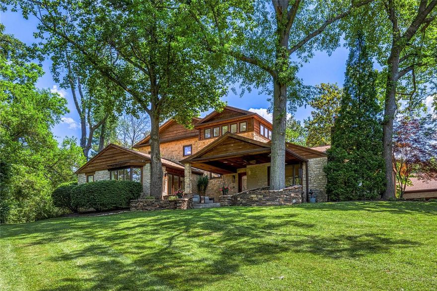 This exquisite estate with FIVE-CAR GARAGE redefines elegance & comfort. Situated on a private lane & nearly 2 acres, every detail is meticulously crafted for sophisticated living. The lodge-like entry offers breathtaking sunset views & wildlife sightings. The open floor plan features two primary en suites, one on the main floor, two laundry rooms, & delightful surprises at every turn. The heart of the home, the gourmet kitchen, is a culinary artist's dream, paired with a stunning adjacent dining room. Besides the main house, the expansive carriage house is a car enthusiast's paradise, recreation, workout room & guest quarters. A sparkling saltwater pool beckons you to unwind in the beautiful outdoor living area. This home effortlessly blends daily convenience with grand-scale entertaining. Enjoy a vacation-like setting while being just minutes from Clayton & Ladue, offering both privacy & accessibility. See this home come to life in our virtual video tour.