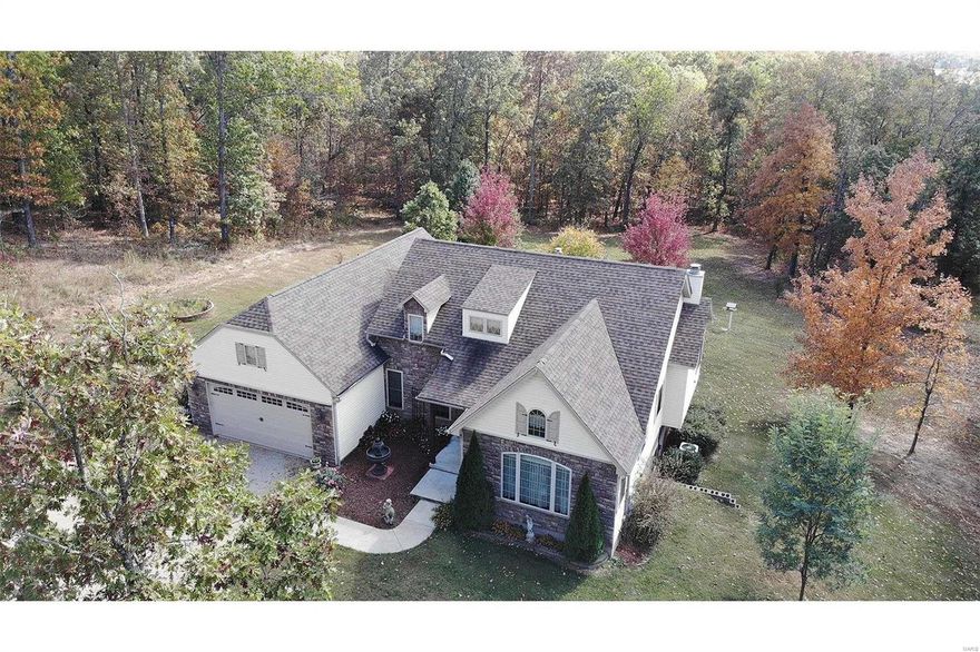 GEORGEOUS 3 bed, 2 1/2 ba home on 6 acres just outside of Farmington. Approximately 2900 sq ft of living space. A main floor master bedroom with adjoining bath &  large walk in closet has been designed with great features including multiple switches to control lights/ fan from the comfort of your bed. The kitchen has solid wood hickory cabinets, with lots of drawers, granite counter tops, center island with prep sink including a garbage disposal, 2 pantries & top of the line appliances, no expenses were spared to take care of the cook in this home. You will enjoy the living room with beautiful wood burning fireplace for cool winter evenings. Screened in back porch perfect for all seasons. The lower level has 2 additional bedrooms, bath & large family room with free standing wood stove. This home is all electric, well insulated as reflected in the LOW utility bills.  Additional 36x24 garage with heat, hot water and 1/2 bath is a rare find.  For list of features of the home, call today!