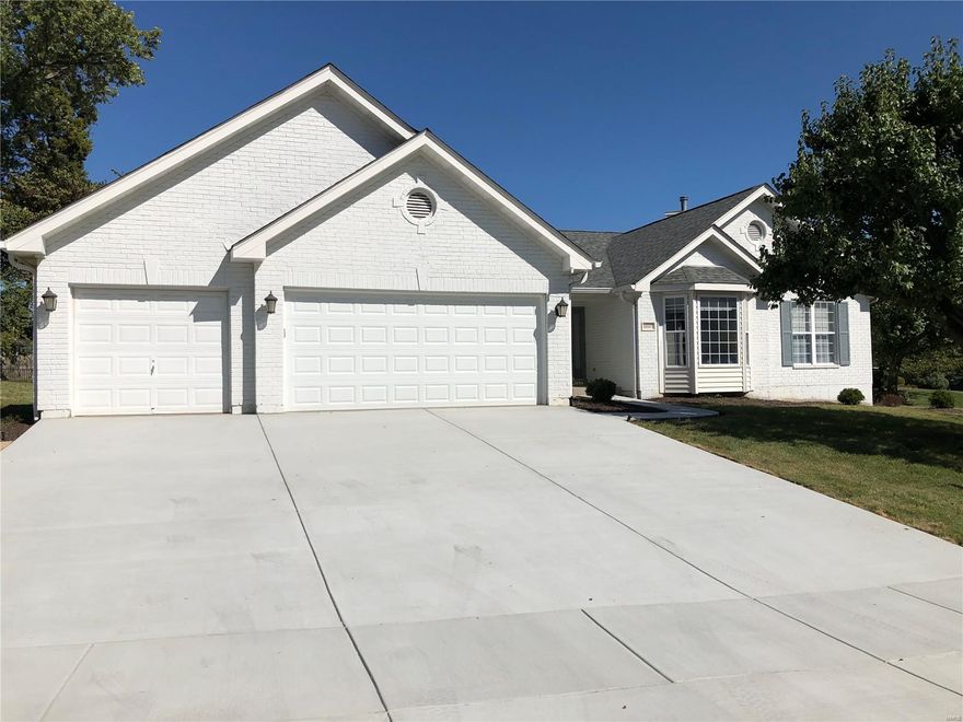 REDUCED & NEW DRIVEWAY INSTALLED. 3 car garage Ranch home. Entry foyer welcomes guest to the formal dining room with vaulted ceilings, & bonus room on the right that could be used as an office/den, or converted to 4th bedroom. Great room features vaulted ceilings with beautiful brick gas fireplace, plant shelves, & tons of windows to enjoy the daylight. Kitchen features center island with smooth top stove, Granite counter tops, tons of work space, breakfast area, & added bar space between kitchen & great room. Sliding door leads to a wonderful covered patio area & fenced yard. Main Floor laundry room. Gleaming hardwood flooring throughout the main floor! French doors lead to Master Suite with walk in closet, vaulted ceilings, bay window, 2 sinks & vanity, separate tub/shower. Guest Bathroom, 2 add'l bedrooms & full bath complete the main floor. Finished basement w/ full bath, wet bar, large family room area & tons of storage. Brand new garage doors! Approx 3,752 sq ft of living space.