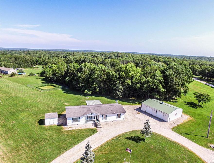 Welcome Home to this beautiful 3bd/2ba gem in the country just 5 minutes from Innsbrook entrance on 2.63 acres. New paint and new flooring. From the covered front porch enter the foyer room/office/den to the left is the master suite and forward to the kitchen/ dining area with a huge island w/sink and 8ft breakfast bar leading to the mudroom.  Through the sliding door, walk out to the large covered deck w/handicap ramp to the driveway, for outside entertaining or just enjoy the wildlife and nature at it's best. To the right of dining room is the large living room w/fireplace with ceiling high stonewall and built-ins leading to 2 more bedrooms & 2nd full bath. The spacious yard is beautiful. The detached 1200 sq.ft. shop building has 2 Doors 8ft. tall and 10ft wide, a service door and is fully insulated. There are 2 other sheds as well and both have electric. The original owner was meticulous in the process of setting this home up. Photo albums are available to page through. Additional Rooms: Mud Room