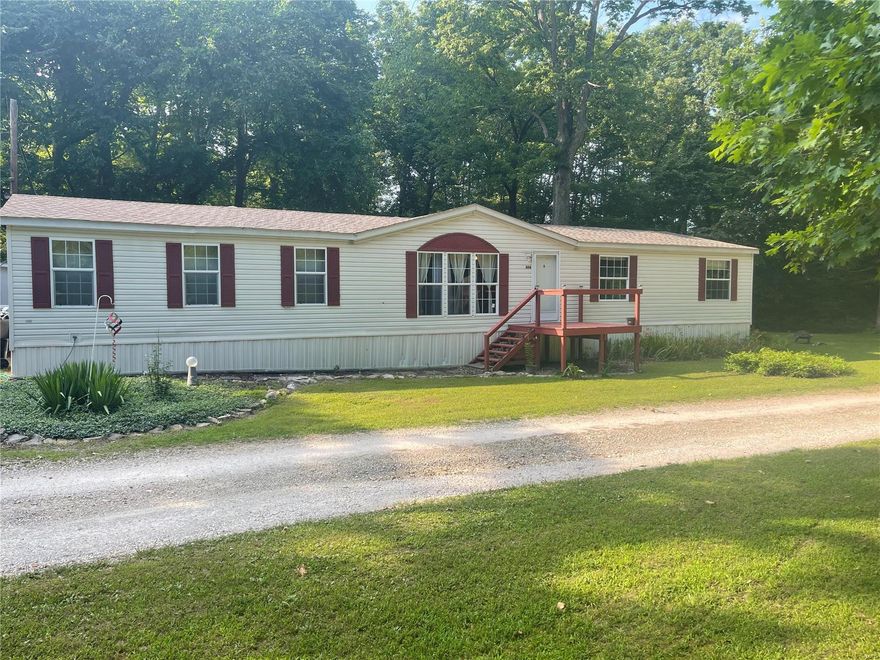 Take a look at this 4 bed room 2 bath manufactured home. It sits on 1.37 acres with a small creek passing through. The abundant wildlife and quiet country living makes this ideal home, yet not too far from the city. 2 car garage, small work shop and a storage area sit on the property. The rooms are large and open. Plenty of room everywhere. Backyard is fenced and secure. This is move in ready. House is selling as is. Sellers to do no repairs.