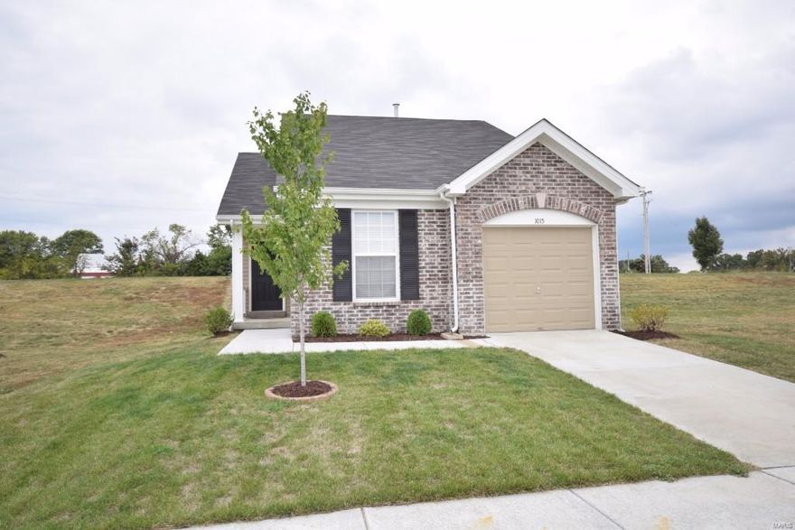 Wonderful move-in ready 2 bed/2 bath open floor plan ranch home with attached 1+ garage located on quiet street, like new! As you enter the home walk right into the large cozy family room with ceiling fan, blinds, and new carpet and paint 7/18! Continue to the bright and cheerful eat in kitchen, which features refrigerator, black built in microwave, dishwasher, disposal, and electric smooth top stove. Master bedroom suite offers a spacious walk in closet and full bath. 2nd bedroom and additional full bath down the hall.  Home is decorated with neutral colors through out.  Full basement, with egress window, rough in and plenty of space for storage! Some framing already started, Ready for you to finish your way!  Located near main highways, stores, parks and top rated Wentzville school district. Charming low maintenance outside (brick veneer and vinyl siding).