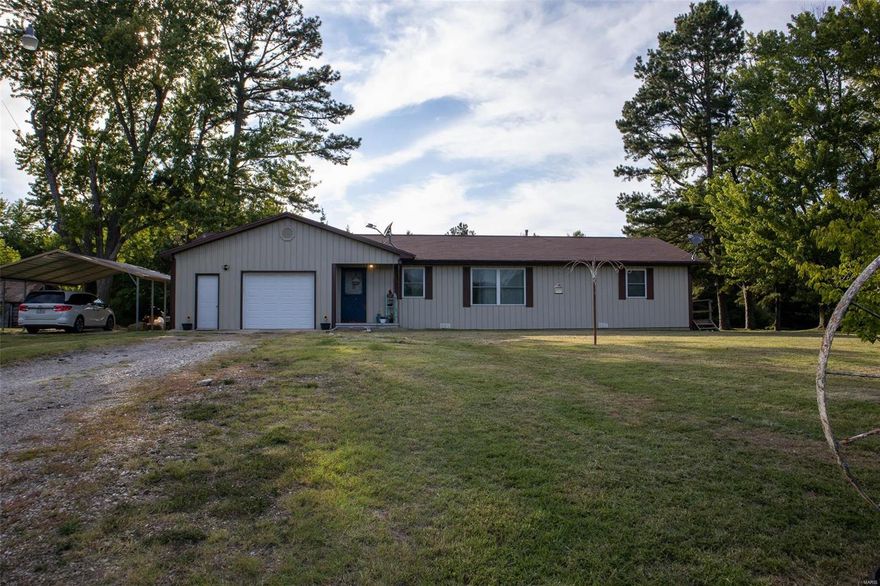 Are you looking for a charming home, in the country, with lots of room, and a huge yard!? If so, this home is for you! This is a 3 bedroom, 2 bath home located in a quiet area between Dixon and Vienna in Vienna school district. Home is conveniently located right off Hwy 28, but far enough from neighbors to give a secluded feel. Home has a large living room/dining/kitchen area. A master bedroom that is roomy, with a connecting bathroom, and his and her closets. An extra-large laundry room, with sink, and cabinetry. Both bathrooms are newly remodeled and beautiful. Home has newer, double-hung windows - they tilt inside for easy cleaning. Property has a large, flat yard that is perfect for kids to play in, family gatherings, or even for bow target practicing. Home has an attached one car garage with lots of extra space. There is also additional covered parking under the 2 car/truck awning carport. This home won't last long - schedule your showing today!