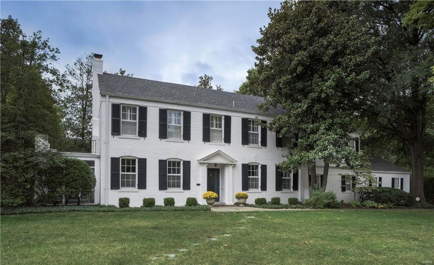 Gracious style and updated finishes make this Ladue home irresistible. The stunning entrance hall, with its graceful curving staircase, sets the tone. Picture-perfect living and dining rooms feature hardwood floors and lovely millwork, while the updated, eat-in kitchen is perfect for today's lifestyle. An inviting family room with woodburning fireplace offers view of the gorgeous yard with its show-stopping playhouse. Upstairs, the master suite is a private oasis, with built-in bookcases, his & her closets and updated master bath with travertine marble details. Four other bedrooms and a newly renovated hall bathroom are thoughtfully planned. The second floor laundry is well-appointed, with custom built-ins. The finished lower level includes a large recreation room, updated full bath and a bonus room that is ideal as office or exercise room. A screened porch, charming patio, three-car garage and the stunning half-acre lot set this property in Ladue School District apart from the rest.