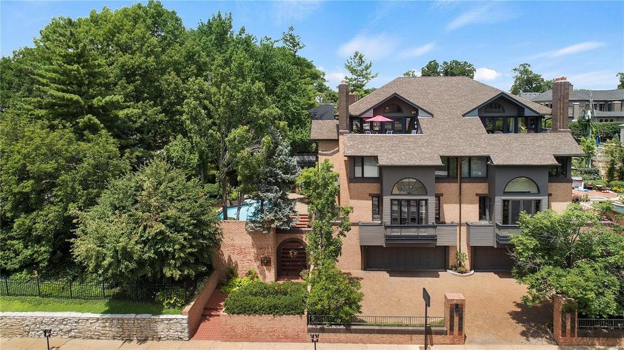 Clayton at it's very best! Immediately upon arriving at this sophisticated townhome you are enveloped by the impressive architecture, lush gardens, beautiful side yard, and stunning pool. A generous entry welcomes you to the appealing open floor plan which offers incredible, unmatched views of the Clayton skyline. The living room and dining room are exquisite and are serene enough for relaxing quietly or entertaining guests. The kitchen and family room are well appointed with eat-in space and a butler's pantry. The elevator allows you to easily travel down to the recreation area, complete with a handsome bar, or to the impressively spacious master suite and bedrooms. Additional special features include: a large 4th story deck with unbelievable views, a sauna, steam shower in the master bath, full bath with walkout access for the pool, and much more. A special property with the convenience and walkability of city living with the quaint quietness of an established neighborhood.