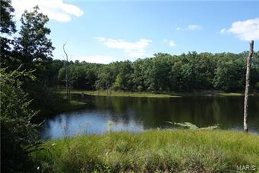 Award winning grass farm = fat cattle!  295 acres combine  pastures, hay field and improved woodlands accented with 4 clay pit lakes.  Rotational grazing system already established with 11 paddocks served by automatic waterers.  160 acres of typical cool season grasses mixed with clover + several areas of thriving warm season grasses .  Not only are the needs of livestock met but quail and wildlife prosper year 'round.  Recreation and production coexist. 
The welcoming 1939 farm home has been renovated with a new upstairs master suite and a sun porch across the back.  2 bedrooms, living room, bath and kitchen complete the main level.  Full basement has laundry and storage.
Hot tub out back close to the vegetable garden.
Outbuildings include a 72x72 metal hay barn, a cattle barn, machine shed, and 3+ car garage.  All buildings are well-maintained.  Solar panels collect enough energy to supply 1/3 of the farm's electricity needs.
View the drone video of this productive farm retreat!