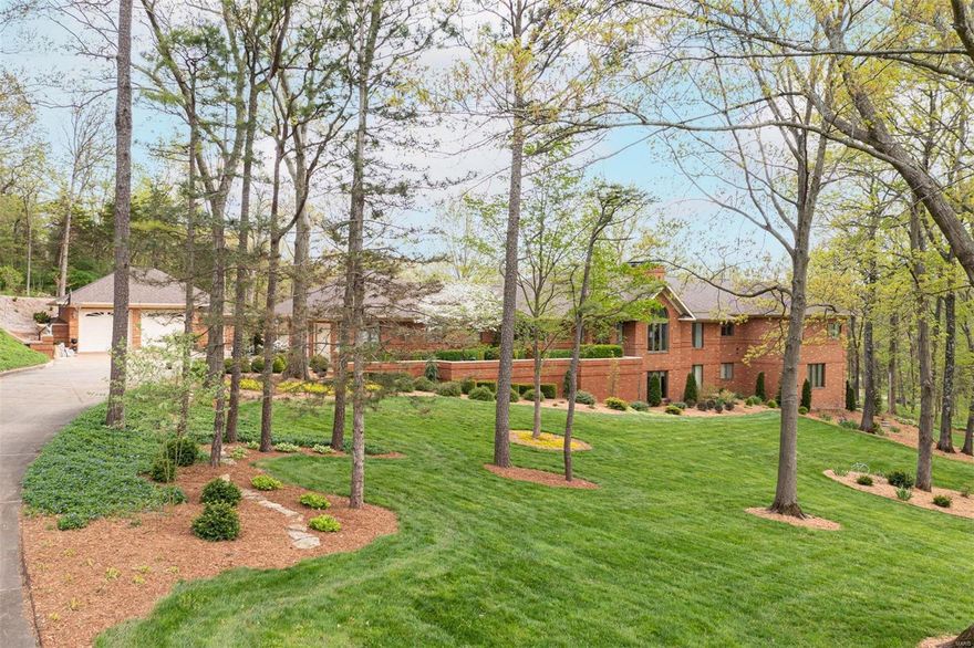 WOW! There are so many words to describe this exquisite, executive, beautiful, comfortable, spacious family home! MUST see for yourself! One of A Kind Full brick, tastefully updated, all the finest thru out, The moment you walk through the beautiful entry wood door w/stain glass into open great room area, floor to ceiling fireplace, fantastic upgraded kitchen w/antique British style sideboard, past the full back lawn, scenic view at open atrium stairway you’ll walk through welcoming BR wing foyer & find 3 large BR's & laundry room. Master suite features sitting area, it's own covered deck to enjoy! Spacious lower atrium opens to entire family/rec room area with 2nd fireplace w/cabinets to hold top of the line electronics & TV that stay with the home, wet bar area w/fridge, library/den, workout room, 4th BR w/wonderful en suite, trophy room w/separate w/o makes this perfect for in-laws quarters. 2 new Geothermal systems! 2 storage areas, one is under garage, possible super wine cellar! Additional Rooms: Mud Room