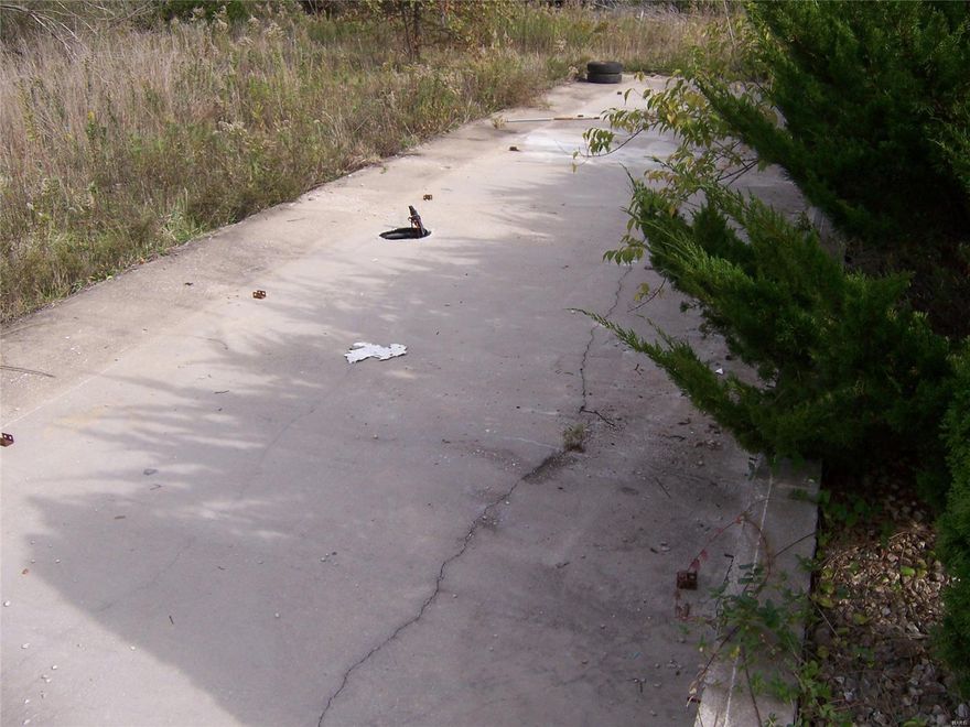 4 Acres setup for a Single Wide!. Has a septic system. Purchasers need to satisfy themselves that septic is working properly. Public water is available along Green Acres Drive. Call today these are hard to fine out in the country!