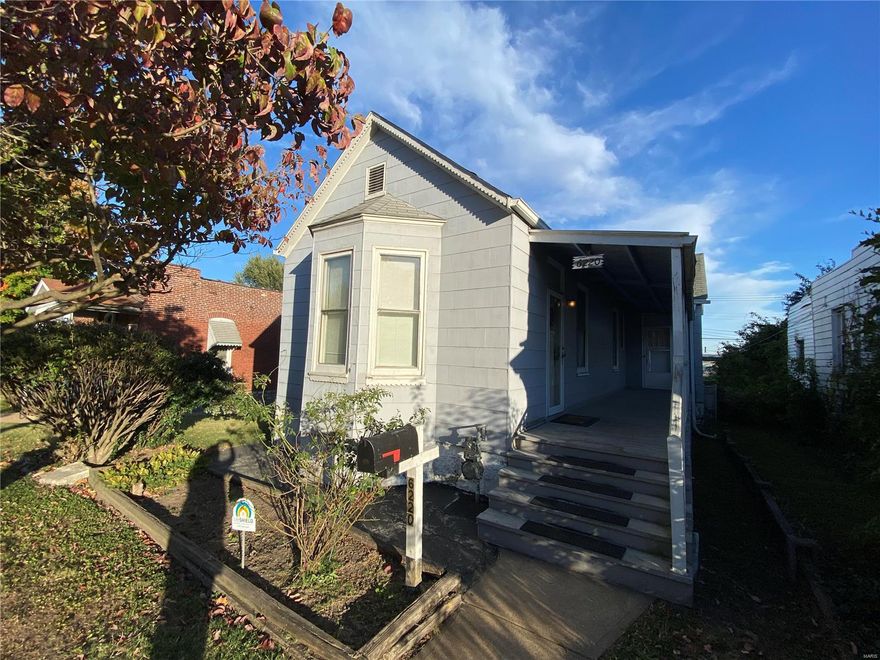 Don’t miss this attractive, move-in ready and updated home, in the Carondelet neighborhood, waiting for you!  Enter the large, awesome front porch where you can enjoy morning coffee or relax in the evening with friends!  Inside you’ll love the 9-foot ceilings, newly updated laminate floors, and the large-sized rooms.  The gorgeous, updated bathroom, spacious kitchen with great cabinet- and counter-space and the separate bedroom off the kitchen are ideal. Resident's used the large Dining Room, with ample closet space + windows, as their main (second) bedroom.  The  basement has a laundry area, shelving and two large areas for you to store your extras, or to finish and make room for entertaining!  Step outside to an awesome backyard with a garage and a private carport, to add to the many parking or storage options! Sold as-is, but not your typical as-is property.