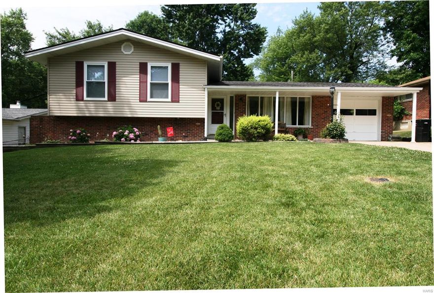 This meticulously maintained, three bedroom home clearly demonstrates pride of ownership. Enter the home through a covered front porch where you can sit back and enjoy the quiet neighborhood. Step in the front door to the living room with vaulted ceilings and lots of natural light. The adjacent dining area opens up to a nicely updated kitchen with newer appliances and views of the landscaped backyard. The upper level features the master and two additional bedrooms along with a full bath and a half. The lower level has a family/recreation room complete with a built-in bar, wood burning fireplace, half bath and French doors that lead out to a large patio perfect for hosting BBQs. Additionally, the large backyard is completely fenced. This beautiful home is move-in ready with too many updates to list but includes; roof (2014), siding, mechanicals, updated HVAC (2013), newer carpets (2015), attached garage and much, much more. Don't miss your chance to make this your new home!