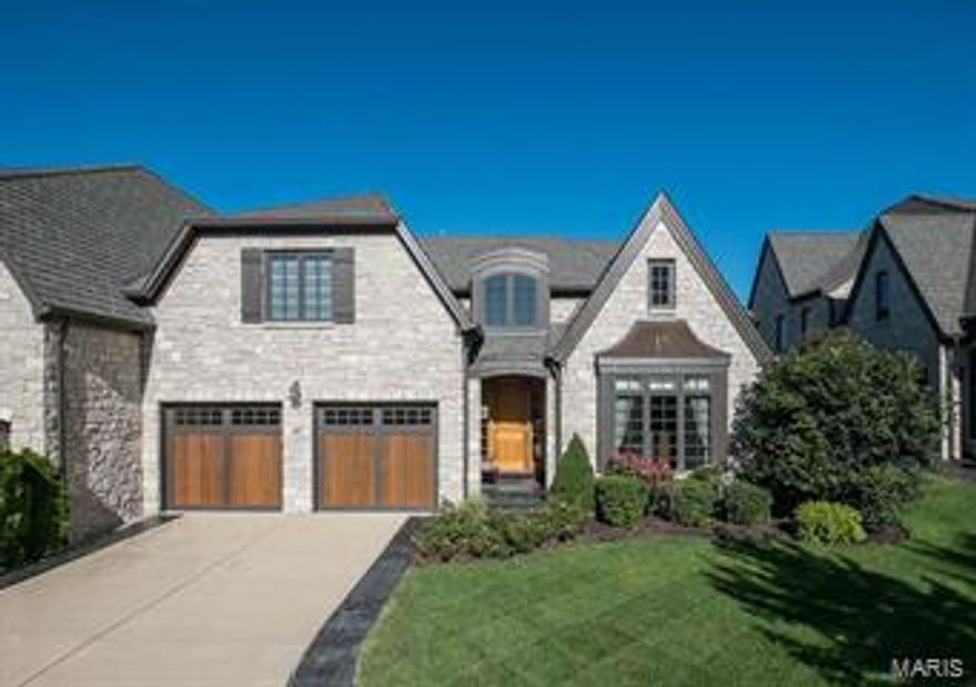 Stunning custom villa located in a secure, gated community.  Arched doorways, stately pillars, tile and wood floors, custom mill-work, transom windows, speaker systems, recessed lighting and multiple chandeliers flow thru-out the entire home. A gourmet kitchen includes granite counters, sub-zero fridge, double built-in ovens, 5 burner gas cook-top, custom bksplash and a 9' island. The fam rm has custom shelving, gas FP, slider doors to upper screened porch and deck. Library/den w/wood paneling.  The main fl master includes a double coffered ceiling w/triple crown molding, lxry master bath, custom walk-in closet. The upper level has bonus room, 2 bedrooms, each with a full bath.  The lower level is an entertainers delight. The bar area includes a wine fridge, ice maker, full dw, granite counters, coved ceiling, stone fireplace, built in tv nook, sliders to 2nd screened porch. The lower level also includes a game room, full bath, temp controlled wine celler, media room, office. MUST SEE! Location: Ground Level, Suburban