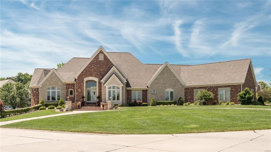 Prestigious Windcastle home will amaze w/full stone & brick exterior. Custom details, exquisite finishes & architectural detail abound from the multi-coffered, box beam & unique ceiling details throughout the home, lighting features, whole house surround sound, exceptional millwork, 4 FPs, central vac & travertine floors. Expansive kitchen w/staggered, lighted glass cabinets w/pull outs & molding, premium appliances, sprawling granite counters & butler’s pantry open to a spacious hearth room. Master suite is a lavish retreat w/built-ins, huge jetted tub, his & her vanities & prof organized closets. Private, elegant study w/FP flanked by custom wood built-ins & cathedral ceiling will impress! Walk-out LL designed for entertaining, w/wine cellar, bar w/cherry cabinets, FP, spacious rec & billiard areas, theater area, bedroom w/full bathroom & flex room! Oversized 4 car garage & custom, main floor laundry. Poolside BBQ’s are a dream in the private, lush garden setting. Incredible value!