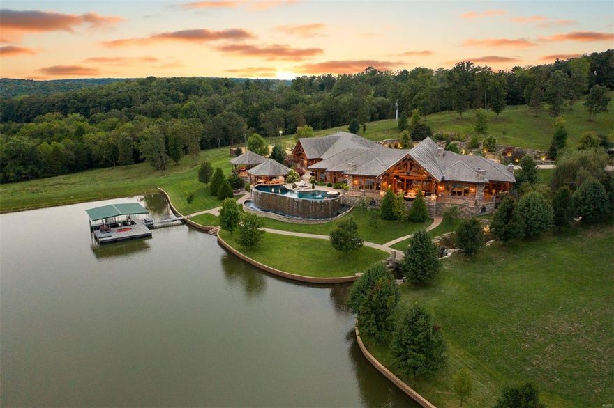 Horse Power Ranch is an elegant ranch estate that stretches across a mile of highway frontage and boasts over 800 acres of pristine property that has been meticulously sculpted into the landscape. The luxury 13,000 square foot log home is of exquisite quality, craftmanship and undoubtedly one of the finest properties in the country. Rich black walnut cabinets and crown molding throughout all milled from the trees on the property. Lakes, ponds, infinity pool plus a working cow calf and equine operation supported by an 11,000 square foot barn and stable.  An additional 10,000 square feet of additional buildings include a 2,400 square foot ranch manager residence and guest apartment. Only 10 minutes from a private airport and resort community of Lake of the Ozarks. Truly a private paradise in the heartland of America.