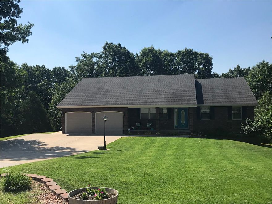 This GORGEOUS, freshly updated FOUR BEDROOM, three bath home (all bathrooms are double vanity) sets on over 2 acres of land in a very quiet setting with a covered front porch AND covered back deck. Featuring an open concept floor plan with rich cherry hardwood flooring, decorative ceilings, and a large chef's kitchen with high-definition laminate counter tops, custom cabinetry, Moen faucet, white ceramic tile back splash, and fingerprint resistant BLACK STAINLESS STEEL appliances. Two bedrooms are located on the main level including the spacious master bedroom retreat with a huge walk-in closet, decorative ceilings and recessed lighting, and an en suite bathroom with large whirlpool tub and separate shower. Two additional bedrooms, a full bathroom, large family/media room with french doors and a stone fireplace centered inside custom shelving are located in the expansive basement which walks out to a serene tree lined back yard. Call today for additional information!