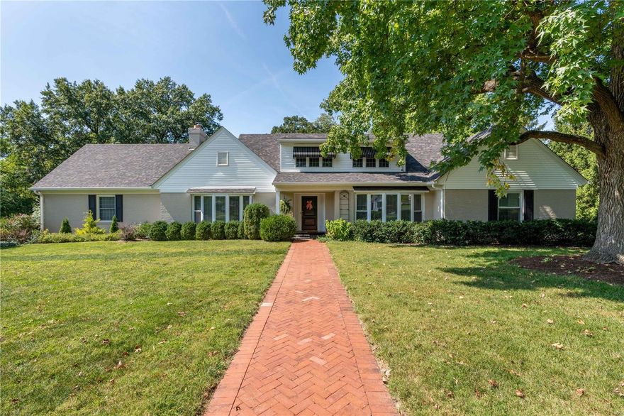 This elegant home sits on a private lane in the heart of Ladue on nearly ¾ of an acre. Beautifully updated and maintained, you’ll find plenty of space for casual living and formal entertaining. Enjoy cooking in the renovated kitchen while visiting with family or friends in the adjacent breakfast room. Unwind in an inviting family room with a gas-burning fireplace and wet bar. Formal entertaining is easy in the separate dining room and living room Spacious four-season sunroom is great for pool parties or yet another place to relax with morning coffee or a good book. Versatile bedroom configuration offers five bedrooms altogether, with two potential primary suites-one on the main level and one on the second level. Retreat to your private backyard oasis with a heated salt-water pool and cool surround decking. Terraced gardens add to the serenity and separate an upper patio from the pool. Convenient pool access to lower level half bath. Mudroom off attached two-car garage. Additional Rooms: Mud Room, Sun Room