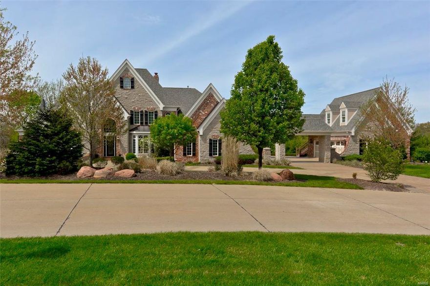 This stately gated masterpiece in the heart of Chesterfield offers 5bds, 9bths, almost 7400sqft living area on a picturesque 3.34 acres w/porte cochere, 5car gar & private apartment. The stone/brick elevation welcomes you into an elegant 2sty foyer flanked by a DR w/trey ceiling & vaulted office. The sophisticated GR w/fireplace is flanked by built-in bookcases, wall of Palladian windows & an expansive arched entry. Enjoy extensive millwork throughout the home. Thru the 2sty hearth rm w/floor to ceiling stone/brick fireplace & wall of windows is a gourmet kitchen w/rich cabinetry highlighted by Wolff & Sub-zero appliances. The spacious brkfst rm walks out to a deck overlooking the outdoor oasis complete w/inground pool, multiple entertaining areas, pergola, stone fireplace & hot tub. The MF master includes coffered ceiling & luxurious bath. The UL boasts 3 nicely sized bdrms all w/ private baths & a bonus rm. The amazing LL includes a FR, wet bar, game rm, media rm, craft rm & 2 baths.