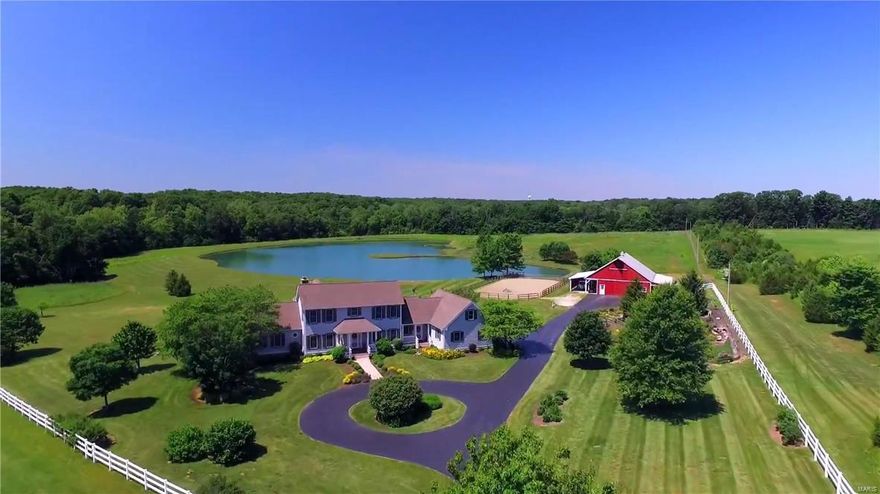 It’s time to make the move! This home sits on 27+ incredibly beautiful flat to rolling acres on a private lane. Features of this property include a private stocked 4+ acre lake, an amazing cedar barn on a solid foundation with 2 awnings/workshop space/hay loft, garden area currently featuring a model rail road, a fantastic riding arena with excellent drainage. There is an in ground lake fed irrigation system covering approx. 2 acres. A portion of the acreage is wooded and there are approx. 6 acres of fenced pasture for horses or cattle. The custom 1.5 story, 2 X 6 framed, 4 bed 4.5 bath home offers a walkout, screened in porch, safe room, special mill work, updated kitchen with a large island and custom cabinetry, and solid surface counters. Home also has an in-law quarters. This home is pre wired for a whole home generator and has whole home surge protection. This property would be perfect for the hunter, horse lover, or anyone wanting a quiet setting to retreat from the daily grind.