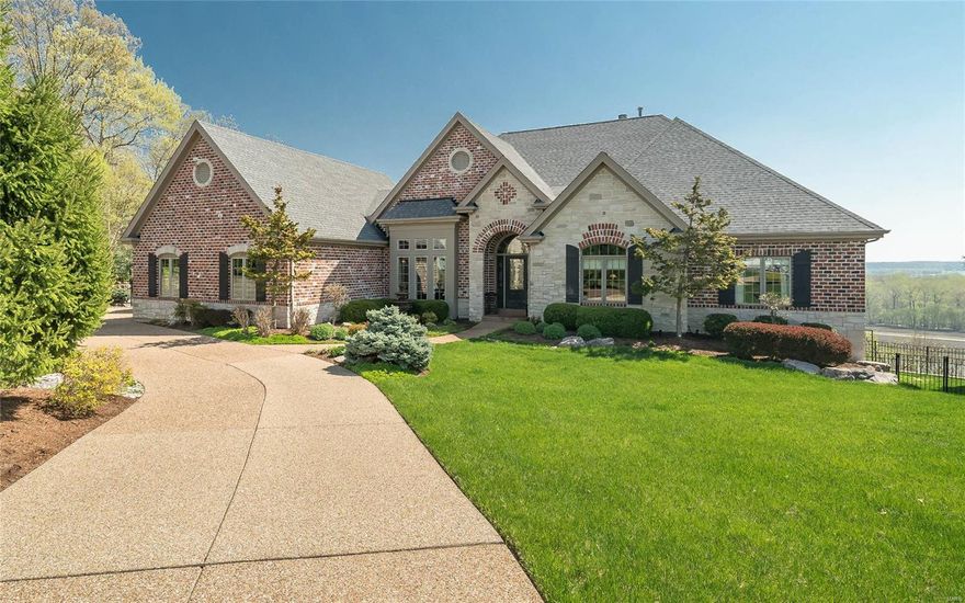 Meticulous craftsmanship & details abound in this custom 4 BDRM, 4.5 bath ranch w/ endless views of the Mississippi Bluffs. This home is nestled on a cul-de-sac embodying sprawling entertaining areas & a perfect private oasis in the backyard w/ a Hot Tub & an in-ground saltwater pool featuring a stone waterfall! As you enter, you are immediately greeted by gorgeous hand scraped hardwood floors that flow through most of the main areas. MF features a masterfully designed kitchen that is every cook's dream w/ its abundance of cabinets, two separate islands & gleaming granite counters. Gorgeous Hearth room off kitchen w/ views of backyard & bluffs! MF also has Den/Office, Formal Dining Rm, Great rm w/picture window, Mud rm, Laundry rm, powder rm, hearth rm, Master bdrm Suite, 2nd bdrm & hall bath.The stunning LL features a recreation room, bar area, wine cellar, 2 addtl. bdrms, 2 full baths & more! There is so much to this stunning one of a kind home that you just have to see to believe! Additional Rooms: Mud Room, Wine Cellar