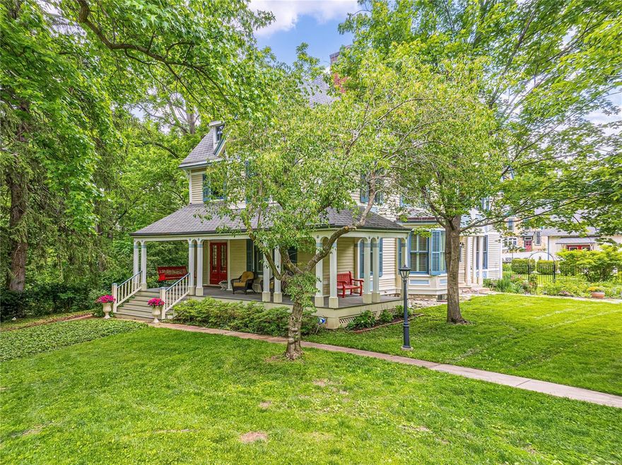 OPEN CANCELED - UNDER CONTRACT Quintessential Historic Webster ~ Queen Anne, circa 1882, built by premiere developer, William Plant. Thoughtfully restored, retaining the beauty and integrity of the era with today's features. Lush park like yard (beckons for a pool), 3 car detached garage/carriage house. Home: 5+ bedrooms, 4 baths, newer kitchen with hearth room, formal foyer, dining and living rooms, front and rear staircases, wrap around front porch, screened porch, 7 fireplaces, wood floors, original hardware, stain glass, transoms, newer wood windows. Wolf & Bosch appliances (double ovens), granite, butlers pantry, hearth room with fireplace. 2nd floor primary, fireplace, walk in closet, luxury bath, laundry room, 3 more beds, hall bath. 3rd floor family room, bedrooms/bath. Zoned heating/cooling, 2 water heaters/electric panels. Carriage house: additional living space (not incl in sq ft) 2 full baths, its own systems including HVAC. Inground sprinkler, wrought iron fencing/gate.