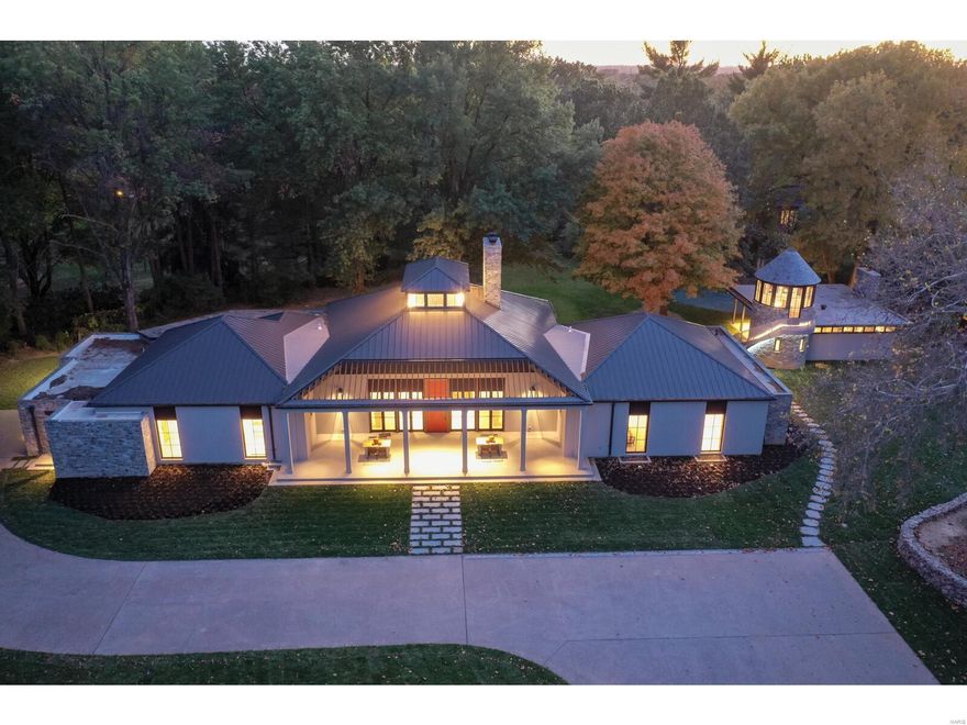 JUST COMPLETED! One-of-a-kind newly renovated architectural marvel on almost 2 acres in Ladue. This sophisticated Smart home has been completely redesigned and renovated boasting extraordinary craftsmanship, superb architectural finishes, extensive custom millwork, exquisite attention to detail and all of the amenities of a new home.  Impressive and unique front porch offers a warm welcome to the light-filled open floor plan. Custom Chef's kitchen includes state-of-the-art appliances, walk-in pantry and large African Fusion granite island. Grand custom bar adjacent to show-stopping hearth room, office (or 4th bedroom) and 3 bedroom suites complete the main level. Elevator opens to spacious lower level with full bath. This like-new spectacular home includes all new systems with geothermal heating and cooling. Backyard oasis includes a pool, luxurious pool house with full kitchen, multiple patios, art studio and a whimsical silo overlooking the tranquil property. Additional Rooms: Mud Room