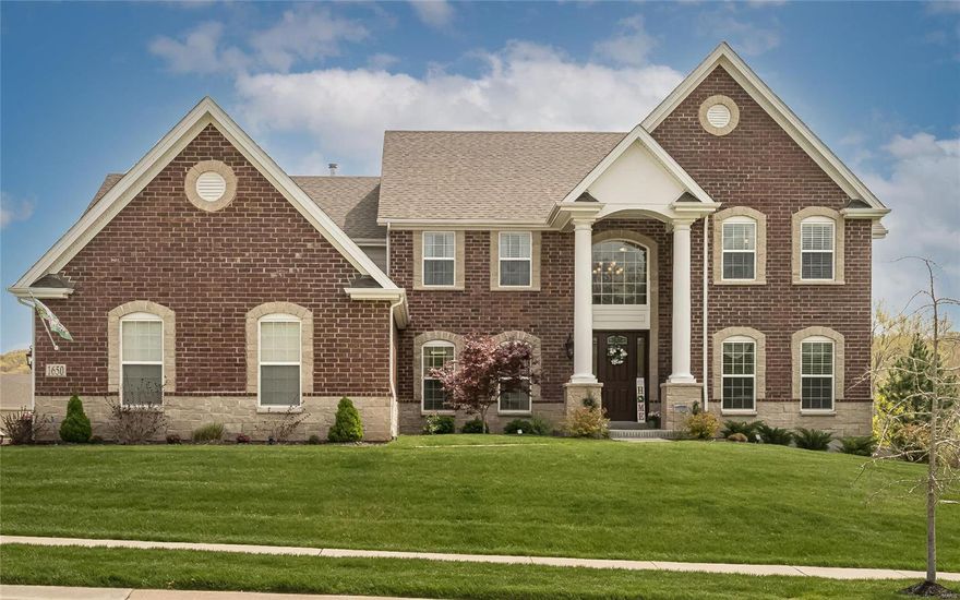 Beautiful custom-built home situated on a level lot over half of an acre. This 1.5 story home has almost 5000sq. ft., 4 large bedrooms, 3.5 baths and many upscale touches. Wood floors, warm décor and elegant lighting welcome you into the perfectly flowing open floor plan. First floor offers a grand entry with an open two-story great room boasting views of the backyard, complete with custom electric blinds and a gas fireplace. Gourmet kitchen has granite countertops, stainless steel appliances, large center island and butler’s pantry with wine fridge.  Kitchen has an amazing view of the  hearth room perfect for entertaining. Gorgeous main floor master with custom walk-in closet, gas fireplace and spa-like bath with double vanities. Three large bedrooms upstairs, two full baths, and bonus room.  Oversized 3 car garage, professionally landscaped and fenced back yard with sprinkler system and lighting. Custom  composite deck leading to an expanded patio area for entertaining and family.