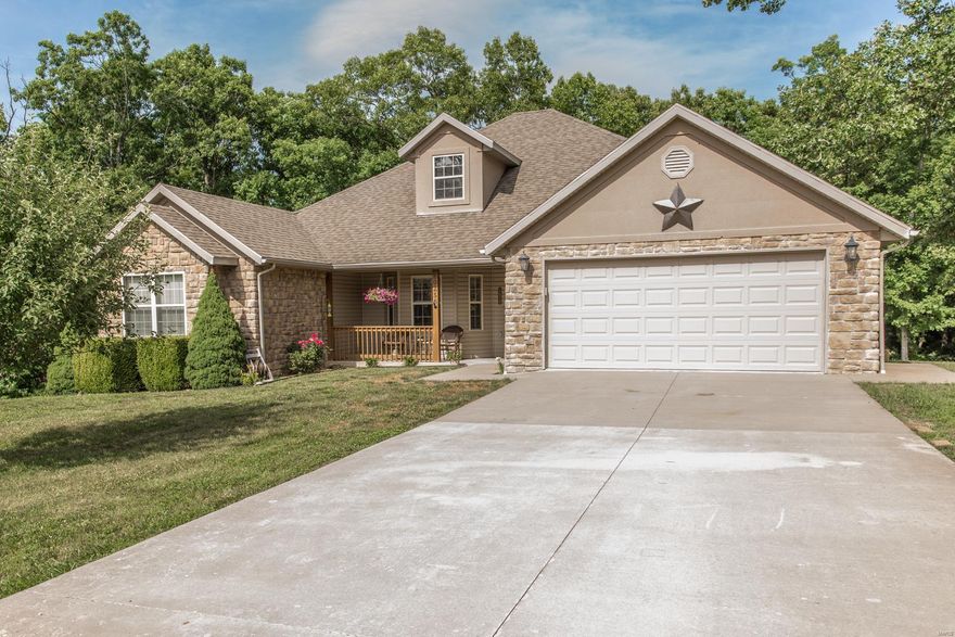 This house has it all! Driving up you'll notice the large lot that backs to trees, pristine landscaping and darling curb appeal, gorgeous covered deck and pool makes for your own private retreat. Walk inside to an open floor plan with beautiful wood floors, vaulted ceilings, huge updated kitchen, rock fireplace, and a popular split design for the bedrooms. Downstairs is a finished walkout basement with new floors in the main area, additional large bedrooms, and tons of storage. This home is everything you've been looking for and more!