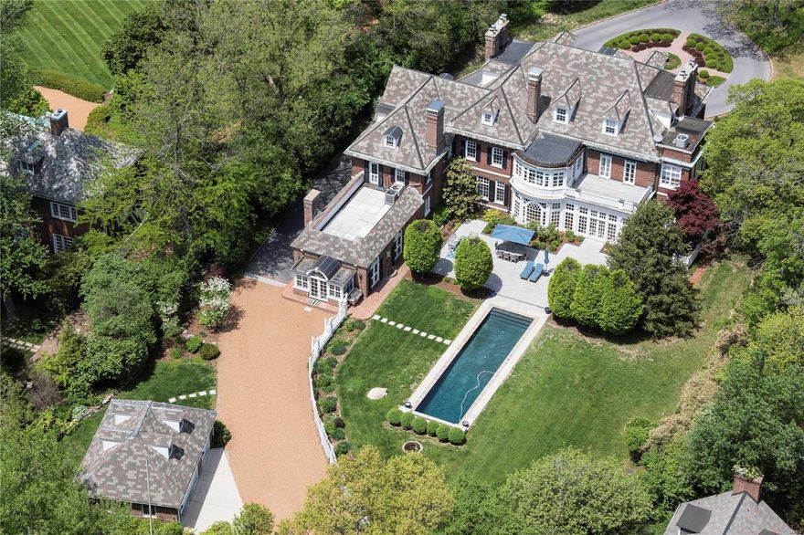 This refined Brentmoor Park estate offers every modern benefit while maintaining the opulence and extravagance of a bygone era. #4 East Brentmoor is one of Clayton's finest showcases; impeccable, in manicured lawns, artful grounds, magnificent pool, patios and terraces. Elegant and graceful, inside and out, the exterior is composed in notes of a stamped concrete circle drive, greenhouse, Carriage House and gardens. The main house is thoughtfully renovated, throughout. A chef kitchen and hearth room, and expansive sunroom, align with classic oversize living and dining rooms. The Master retreat and office have breathtaking views of the pool and gardens. Dual dressing rooms and a marble bath complete the suite. All bedrooms enjoy a fireplace. Ideal for entertaining or fundraisers, the private gated entrance opens to Wydown Boulevard, for strolls to boutiques, Bar Les Freres, I Fratellini, Billy Jean and Starbucks. An exclusive lifestyle resting on 1.5Acres. Elevator service to 3 levels. Additional Rooms: Sun Room