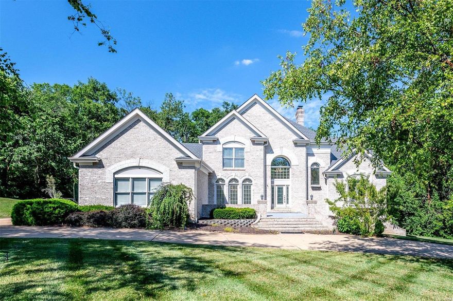 Welcome to 12817 Topping Woods Estate Dr, a 1.5 story luxury home situated on a 1-acre lot in sought after Town & Country. Exquisite kitchen w/custom cabinetry, granite countertops, SS dishwasher, wall oven, microwave & gas cooktop w/downdraft vent. Composite deck off the breakfast room overlooks the patio & expansive backyard. Spacious open floor plan includes separate dining room, great room w/gas starter fireplace, breakfast room, hearth room w/wood burning fireplace, office & main floor master suite, which includes walk-in closet, soaking tub, walk-in shower & double sinks. 3 more large bedrooms with 2 full bathrooms on the 2nd floor. Stunning atrium off the great room allows for tons of natural light and leads to the finished LL with a large entertaining area w/fireplace, kitchenette, 2 bedroom suites, & exercise rm; plenty of storage. 3 car garage! Irrigation system. AAA Parkway West Schools. Easy access to Hwy 270 & 40, The Lodge Des Peres & several parks. Schedule today!