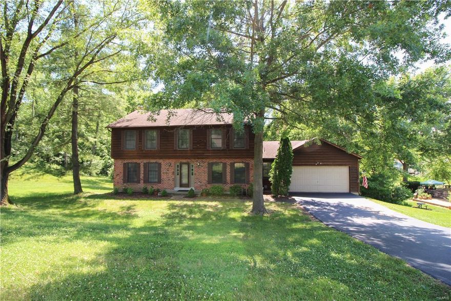 Located in the beautiful Marquis Estates Subdivision, this 4bed/2.5bath Sunset Hills home is sure to fit the needs of it's next owner--a wonderful opportunity to become part of the award winning Lindbergh School District! The current owners have done an excellent job maintaining this home through the years and it's very evident as soon as you enter. Clean from top to bottom, the main level offers a large great room with a wood burning fp, built in shelving and a wet bar. The eat-in kitchen is equipped with plenty of cabinet space and storage with access to the large deck. A sitting room, formal dining room, powder room and laundry room make up the remainder of the main level. Upstairs you will find 4 large bedrooms with good closet space in each. The master suite is impressive with a vaulted ceiling, a walk-in closet and a large private bathroom. The walkout basement offers additional living and storage space with a separate room under the garage that could be used as a workshop.