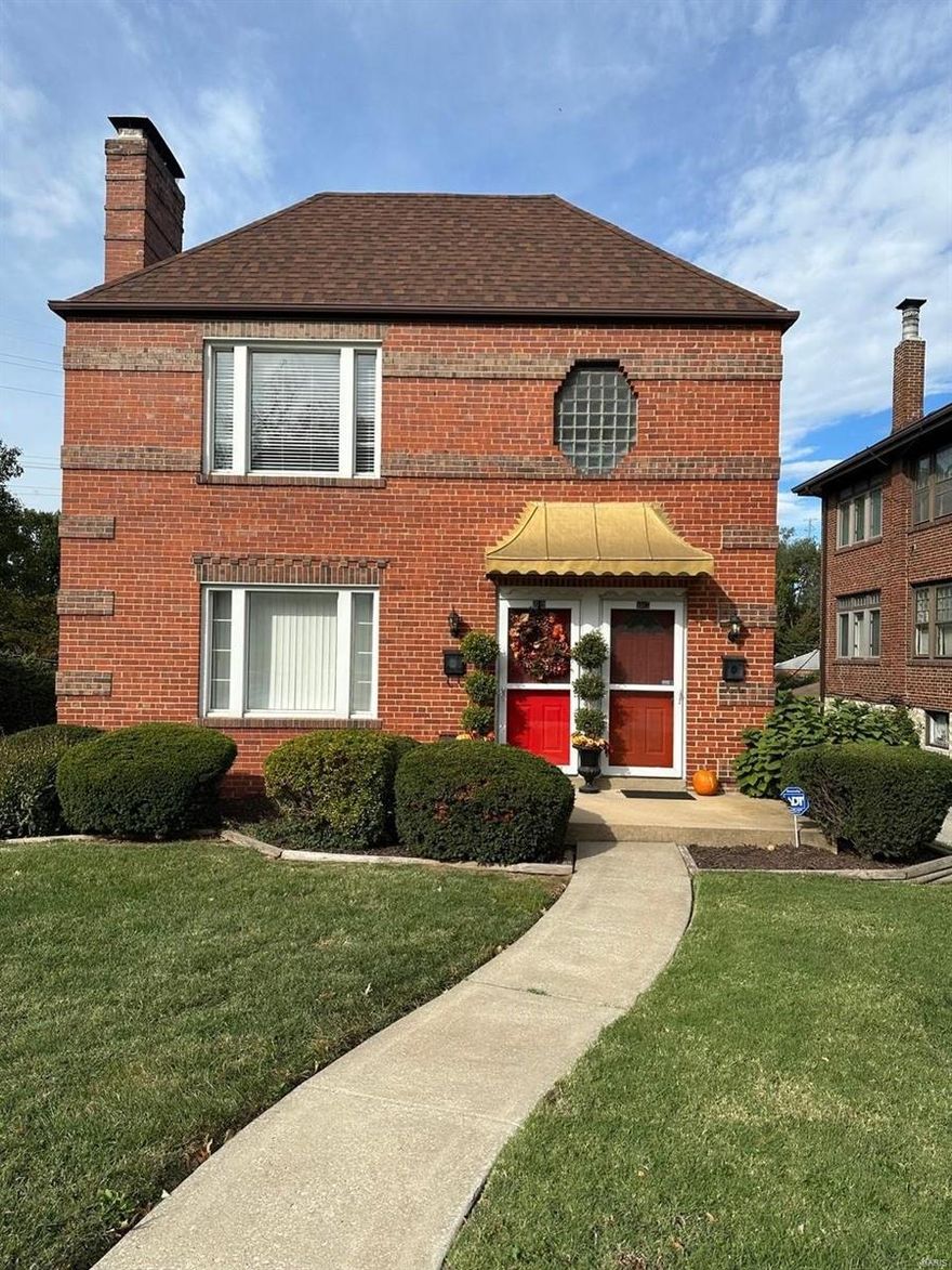 Charming brick duplex in CLAYTON SCHOOLS! This upper level unit features two bedrooms and 1 bath, some hardwood floors, crown molding, gas FP, & white 6-panel door, kitchen has white cabinets, enclosed porch w/french doors*Basement w/storage available, washer/dryer hook-ups, Level & partially fenced backyard. Highly sought after Clayton Schools, near Brentwood Promenade, downtown Clayton, & Forest Park. Location: Upper Level