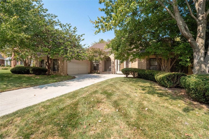 Fabulous Opportunity to make this Special Home Yours.  Built & Resided for 34 years by the Original Owner who lovingly maintained & updated.  Perfect for Today's Lifestyle w/ High Ceilings thruout & Very Open Floor Plan. 4800 Sq Ft of Living Space w/3400 On Main. Enter into a Large Soaring ceiling Foyer w/Handsome Custom Wood Office on right & Dining Room area on left.  Straight ahead you will be WOWed by the Grand Great Rm opening to Newer Deck w/ Fireplace & bar area.  Huge White kitchen breakfast rm opens to the deck.  Large island & natural light abounds!  Great Pantry & Laundry room/ Half bath plus shower area to clean your Pup.  Main floor boasts 2 bedrooms and 2.5 baths.  Enormous Primary Suite with fireplace & His &Her Baths.  New Shower.  The Saircase to the High Pour Lower Level Is Wide & Open. Family Rm w/ Fireplace + Office area.  2 Large bedrooms & Full bath.  An Abundance of Unfinished area in the Lower Level too.  Walks out to Patio & Private Wooded Lot.