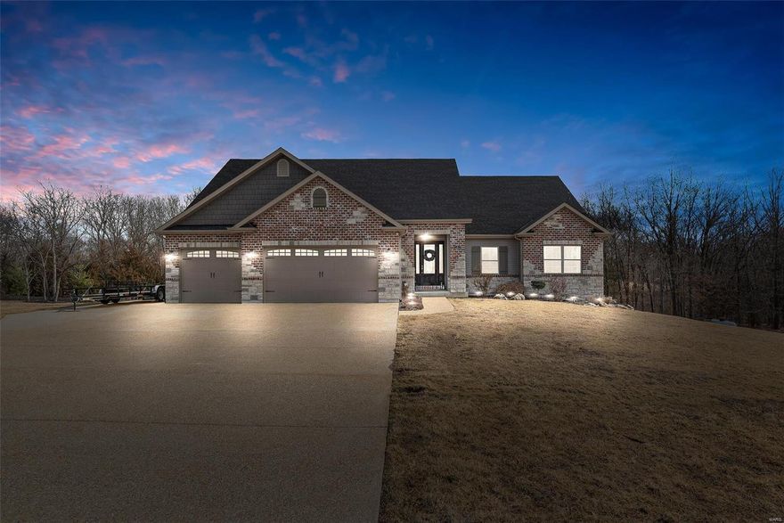 Stunning stone & brick ranch-style home on 3+/- acres in sought after subdivision.  The grand stone entrance opens to an expansive great room featuring floor to ceiling stone, gas fireplace & wall of windows overlooking lush foliage.  The open floor plan features a breakfast room, top of the line kitchen offering an abundance of cabinets, granite, tile backsplash, Wolf gas stove, stainless appliances, double ovens & a large California Closets walk-in pantry.  The main floor laundry has a closet & storage cabinets.  The owners' suite is generously sized, has a tray ceiling, massive walk-in closet w/ California Closet system, luxury bath featuring double bowl vanities, walk-in tiled shower, soaking jacuzzi tub.  Rounding out the main floor are two additional bedrooms & a full bath.  The walk-out lower level is an entertainers dream w/ massive family room, wet bar w/dishwasher, 4th bedroom & full bath. PAVED streets (2021). See additional features sheet attached.