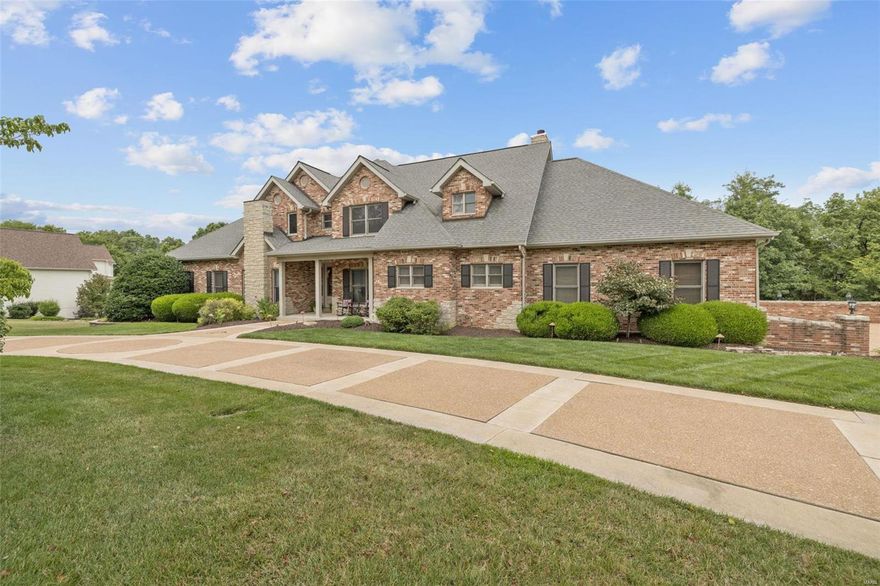 Experience the epitome of rustic Resort-Style living with this elegant brick & stone sanctuary, featuring park-like grounds (4.15 acres) and upscale indoor/outdoor living. The gleaming wood floors accent the main level, styled for today's lifestyle. As you enter, you'll be captivated with the soaring ceilings and open-spacious floorplan, not to mention the beautiful wall of windows which fills this home with natural light throughout.  The distinctive kitchen, with granite counters & custom cabinetry boasts the stunning, stone center island, which is sure to please as you entertain family and friends.  You'll unwind & embrace the simple, yet sophisticated Primary Suite featuring the private deck, fireplace, soaking tub, and more! The inviting inground pool, enveloped by nature & entertainment spaces, is beckoning you for a dip! This 5 bedroom/5 bath + 2 half bath home seamlessly combines natural elements with modern comforts throughout. Your Idyllic Country Oasis is calling you home!