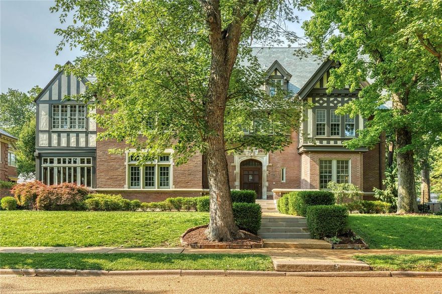 Step into the grandeur and feel the history of this remarkable Tudor Revival, originally built in 1909 by renowned architect Louis LaBeaume. Once owned by prominent figures like John W. Kauffman and families such as the Wrights, Lemps, and Lamberts, this historic gem showcases hand-carved millwork, a grand parlor, a Chinese-inspired solarium, and a prohibition-era rathskeller. A Crest with "Vino Mujeres Y Canto" - meaning "We got wine, We got women, and we got songs" can be found on the fireplace in the once-upon-a-time "pub". Recent updates include a stunning remodeled kitchen with Carrara marble counters, Ilve Italian 7- burner gas range, a luxurious primary suite in the east wing with a private lounge, two baths, and a walk-in dressing room. Mechanicals are updated as is the impeccable exterior. This tastefully renovated residence is located in a coveted neighborhood. Experience the perfect blend of timeless elegance and modern convenience in this extraordinary piece of history. Additional Rooms: Sun Room