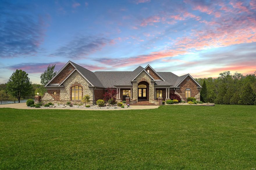 Custom built ranch on 3 acres backing to private lake! This home boasts 3,700+ sqft, 4 Beds & 2.5 Baths! Therma-Tru front doors, 11 ft ceilings, crown molding & wood floors; Office/4th Bed with french doors, crown molding & walk-in closet. Stunning Great Room boasts 13 ft ceilings & stone gas FP. Kitchen features custom cabinets/undermount lights, granite, breakfast bar, SS appliances & walk-in pantry. Finished back porch with wall of windows/lake views, porcelain tile floors & all weather ceiling fans. Master Bed with huge window overlooking the lake & luxury Bath; 2 nicely-sized Beds connected by Jack/Jill Bath. Main Floor Laundry! Extra wide staircase to W/O LL with egress windows, laundry & plumbing rough-ins! Highlights: newer roof, Honeywell humidifier, tankless WH, (2) 200-amp electric panels, Toro irrigation system-19 zones & rain sensor. Relax on the paver patio with water feature & enjoy the huge backyard! Great location - close to Innsbrook, shops, restaurants & hwys!