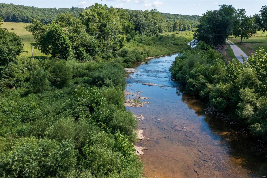 ABSOLUTELY GORGEOUS FARM FOR SALE! This property was once part of one of the largest cattle farms in the area and in the same family since the 1930's. This farm has it all; rolling hills, privacy, spring fed river, pond, barn, mature woods, and VIEWS. You will not find another property on the market in this area with potential this one has. Currently set up for cattle with fences and cross fences, water and pens. Could easily be tillable acreage, homesite, winery, or airbnb. This property sits in the beautiful Coffman, Missouri area, known for winery tourism. Listed at appraised value!