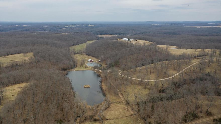 Phelps County has a hidden gem with 620 +/- acres of beautiful pasture, untouched timber, ponds, springs, lake, and structures. This is your chance to own your very own section of land in Missouri. Large rock house, 100+ year old log cabin, train caboose, horse barn with hay loft, spring house, and lake. Each structure has working electric and water to them to enjoy or have people come visit. Property has very own indoor horse riding arena. This arena is roughly 75’x150’. This also includes five indoor horse stalls, a tack room, and wash room. Electric, water, fencing at arena. Property contains multiple ponds, four acre lake and multiple creeks. Multiple springs and springhouse. The property is made up of roughly 350 acres of beautiful pasture and  270 acres of mature timber. Tons of wildlife on this property for hunting. Trails throughout property Many gates and fences make it easy to bring in a cattle or horse operation. This farm will surly not disappoint and is a must visit!