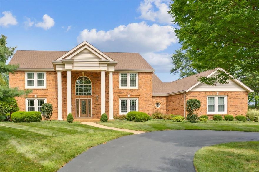 Nestled on a level one-acre lot, this impressive home combines classic charm with modern amenities. With over 5,000 square feet of living space, it offers room to breathe and grow. Step inside the two-story foyer, where natural light dances through elegant windows. The two-story great room features a wet bar and a gas fireplace, perfect for gatherings. On the main level, discover a guest bedroom with a full bath, living and dining room. The gourmet kitchen boasts a center island, double ovens, a downdraft cooktop, stainless appliances, and a walk-in pantry. A light filled sitting room and laundry room is located just off kitchen. Upstairs, the luxurious primary suite awaits, complete with a private sitting room and a beautifully remodeled bathroom. Two additional bedrooms and full bath. Lower level has a large recreation room and office or exercise room, half bath, and huge storage room. The three-car garage, with a high tech new opener and ample space for vehicles and storage.