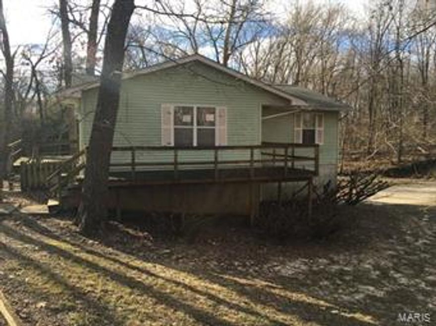 LOOKING FOR PRIVACY...STOP THE CAR!!!  RANCH STYLE PROPERTY LOCATED ON JUST OVER 1 ACRES ON WOODED LOT WAITING FOR ITS NEW OWNER!!!  HOME HAS LARGE LIVING/DINING AREA AND KITCHEN WITH GLASS DOORS TO 1 OF 2 DECKS.  THREE BEDROOMS INCLUDING A MASTER SUITE AS WELL AS A FULL HALL BATH.  BASEMENT HAS A COUPLE OF FINISHED ROOMS AND WALKS OUT TO THE BACK YARD.  TUCK UNDER 2 CAR GARAGE PROVIDES OFF STREET/SHELTERED PARKING.  Property offered in current condition-to be Sold As-Is. Special Sales Contract required. Seller to do no repairs nor to provide for any inspections. Prequalification or proof of funds are required with contract. Seller reserves the right to negotiate offers in any order regardless of date/time submitted. It may be 24-72 hrs for any response from seller. Typical seller's hours are M-F, 9-5 SpecialListingConditions: Foreclosure