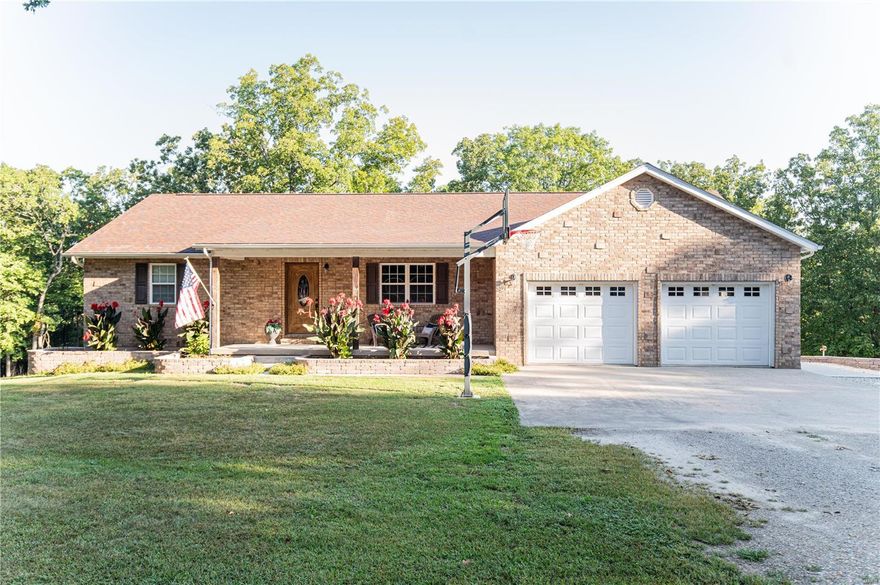 Welcome to paradise!  This 4 bedroom 2.5 bath sits on 10 acres m/l and just a short distance from town.  This home features spacious rooms, laminate flooring throughout, custom cabinetry and finished basement.  This home has a large 30x30 shop with a 30x12 lean to.  The shop is heated, has electric, bathroom and small kitchenette perfect for entertaining.  There is a Hardy wood stove for heat and electric furnace for backup.  Basement has a small garage perfect for lawnmower or UTV/ATV storage.  There is a vaulted area under the porch, perfect for storage.  The back deck has a great view and perfect place to relax in the screened in area or for grilling on the open air side.  There is no shortage of wildlife on this property.  This home has so much to offer!  There is up to an additional 10 acres available for purchase.