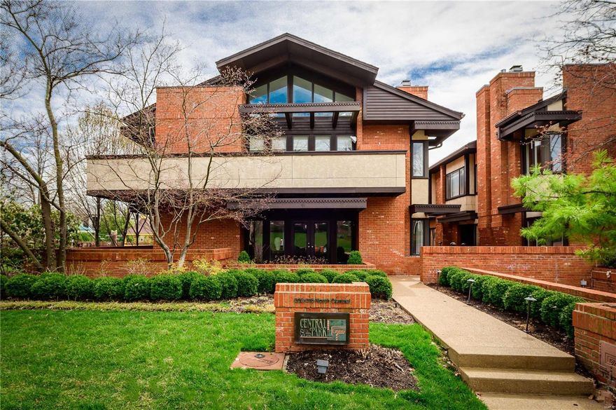 Sophisticated "Central on the Park" condominium located on a beautiful tree-lined street in the heart of Old Town Clayton. L/R w/ handsome hardwood floors & fireplace opens to D/R w/ custom built-in serving station.  Delightful chefs kitchen w/ custom cabinets, top-of-the-line appliances, Quartz counters and huge pantry adjoins the F/R with picturesque windows. Master bedroom retreat features gas fireplace, large walk-in closet, luxurious bathroom with heated marble floors, his & her vanities, soaking tub and large shower with bench and multiple heads. 2nd bdrm w/Glen Alspaugh bath & another bedroom/office w/built-ins & lighting. Private views from the deck off the master and 2nd bedroom suite overlooks your private garden. Lovely brick patio surrounded by professional landscaping including water feature & outdoor speakers makes great entertaining space in a serene setting, next to Taylor Park. 4-car tandem garage w/ heated driveway. Walking distance to everything Clayton has to offer! Location: Ground Level